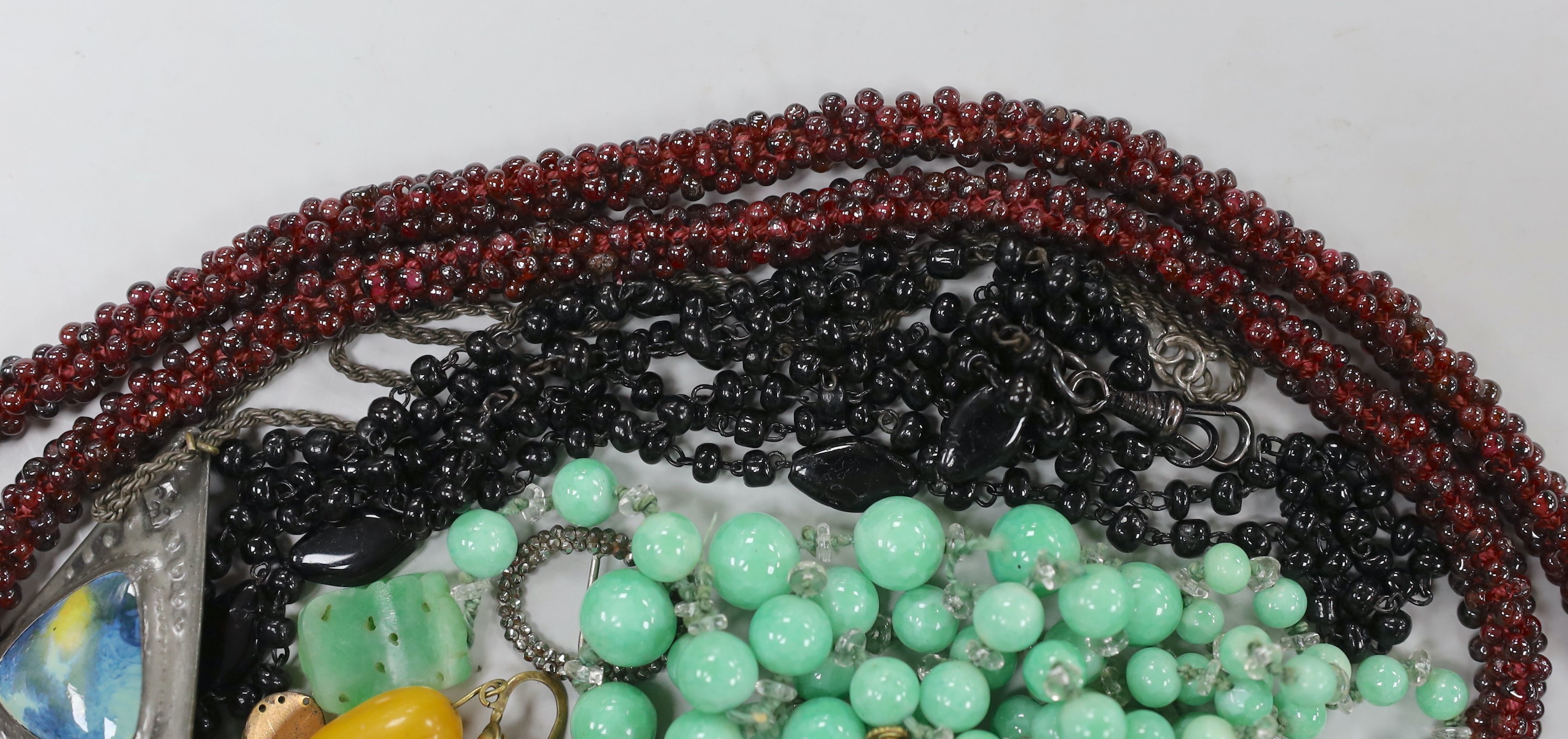 Assorted minor jewellery including a garnet bead cluster necklace, 64cm, a small cut steel buckle, glass bead necklace, etc.